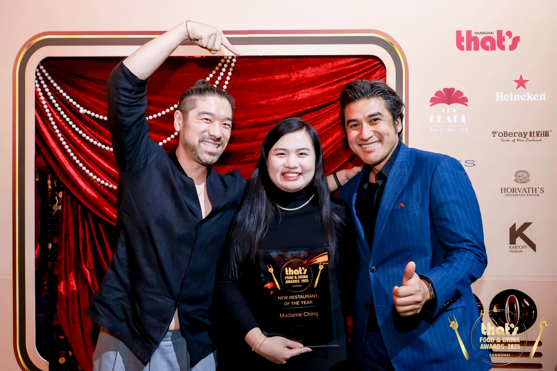 Nil Shrestha with chef-founder Derek 'Dali' Wong and the New Restaurant of the Year plaque